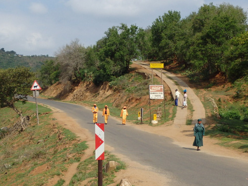 The road to the left (at T intersection).